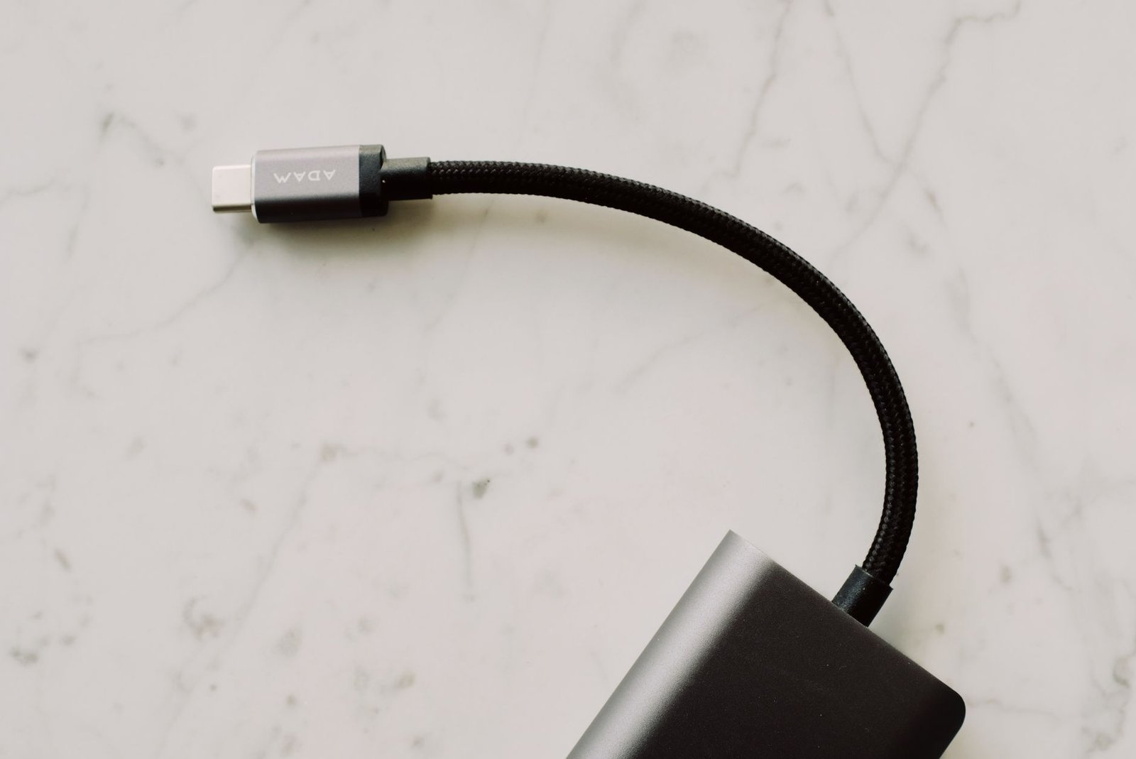 A USB-C cable, the tether that connects AR glasses to a phone or laptop