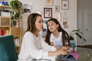 Parent and child comparing the best parental control app 2026 options on a tablet at home