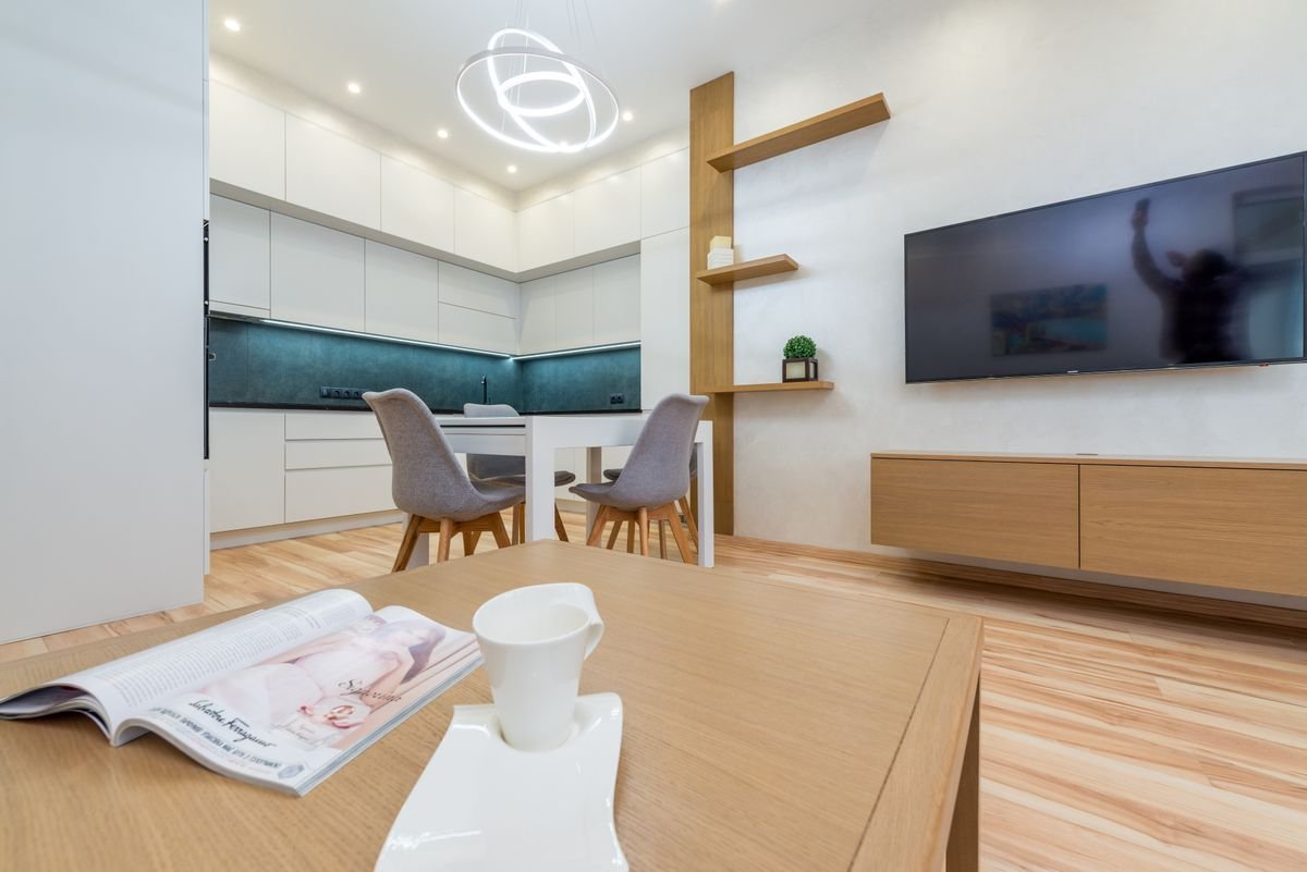 Bright modern living room with a wall mounted TV for streaming