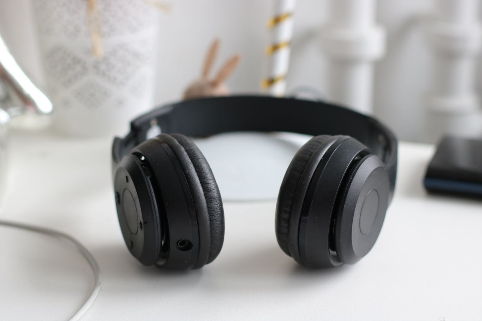 Budget over-ear wireless headphones on a desk