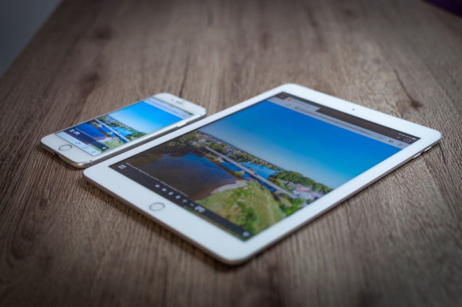 A tablet and a phone side by side showing the same page in a light-use comparison