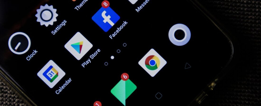Person tapping settings to free up phone storage on an iPhone and Android phone side by side.