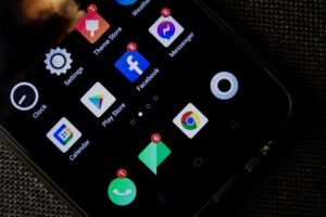 Person tapping settings to free up phone storage on an iPhone and Android phone side by side.