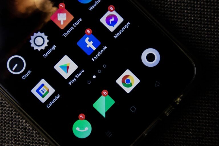 Person tapping settings to free up phone storage on an iPhone and Android phone side by side.