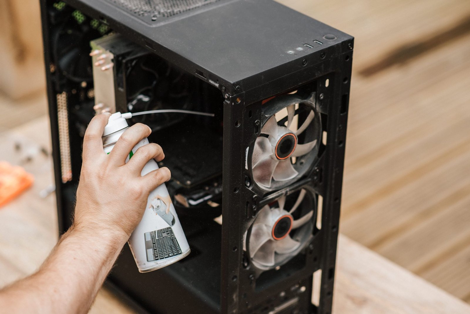 Using compressed air to clean laptop cooling vents
