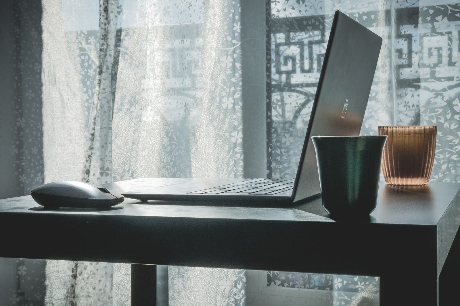 Laptop overheating in summer near sunny window desk