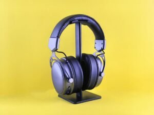 Budget over-ear noise cancelling headphones under $100 on a bright colorful surface