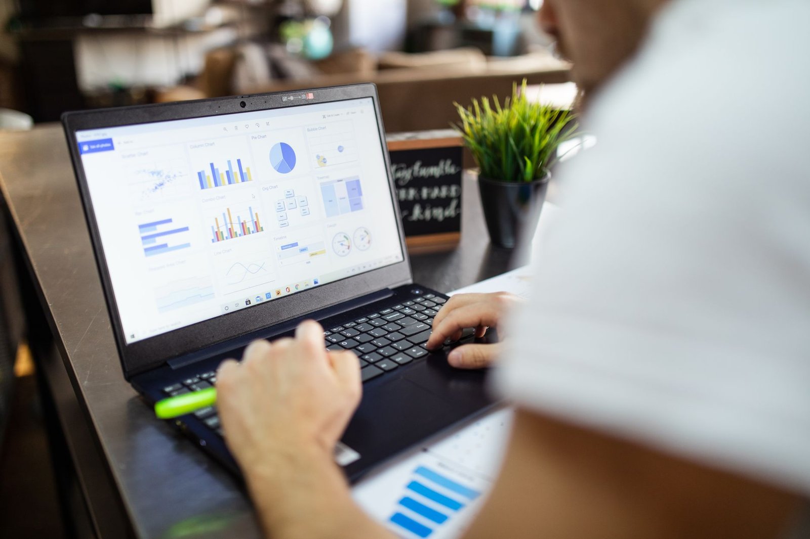 Laptop screen showing an organized budget with colorful charts