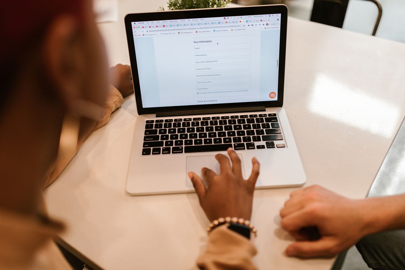 Filling out a data broker opt-out form on a laptop