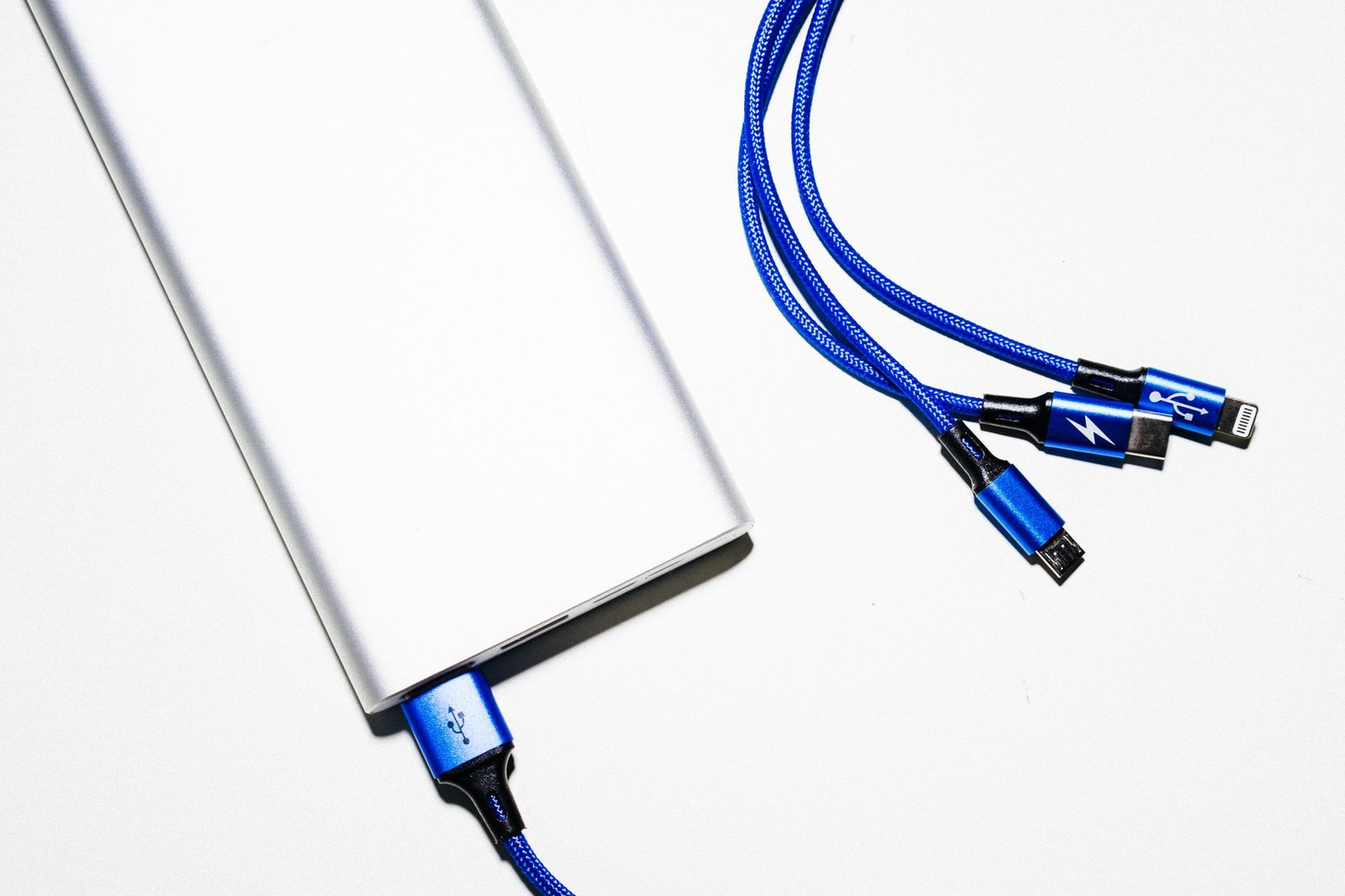 A charging cable beside a portable power bank