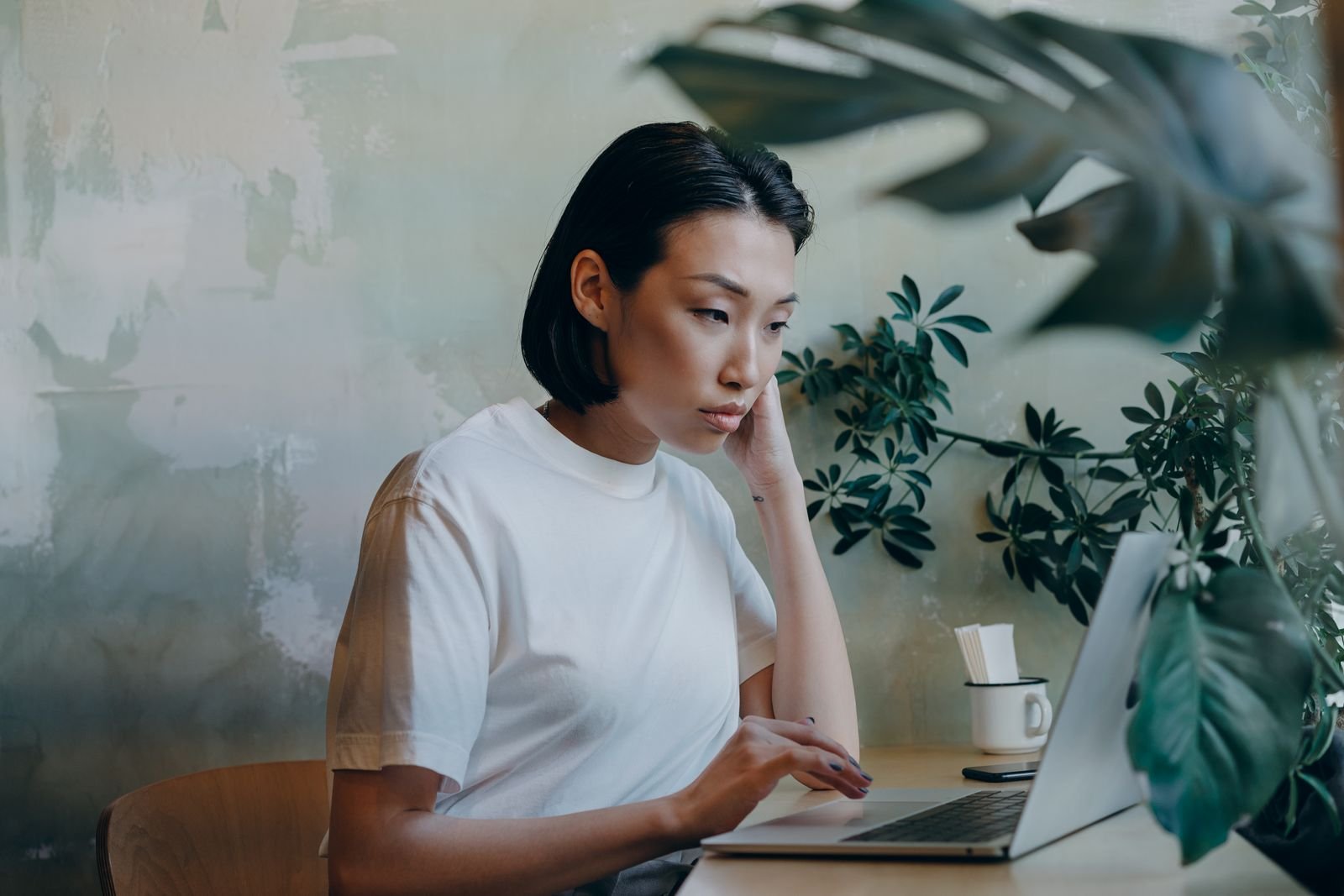 Person reviewing their online privacy options on a laptop before choosing a data removal service