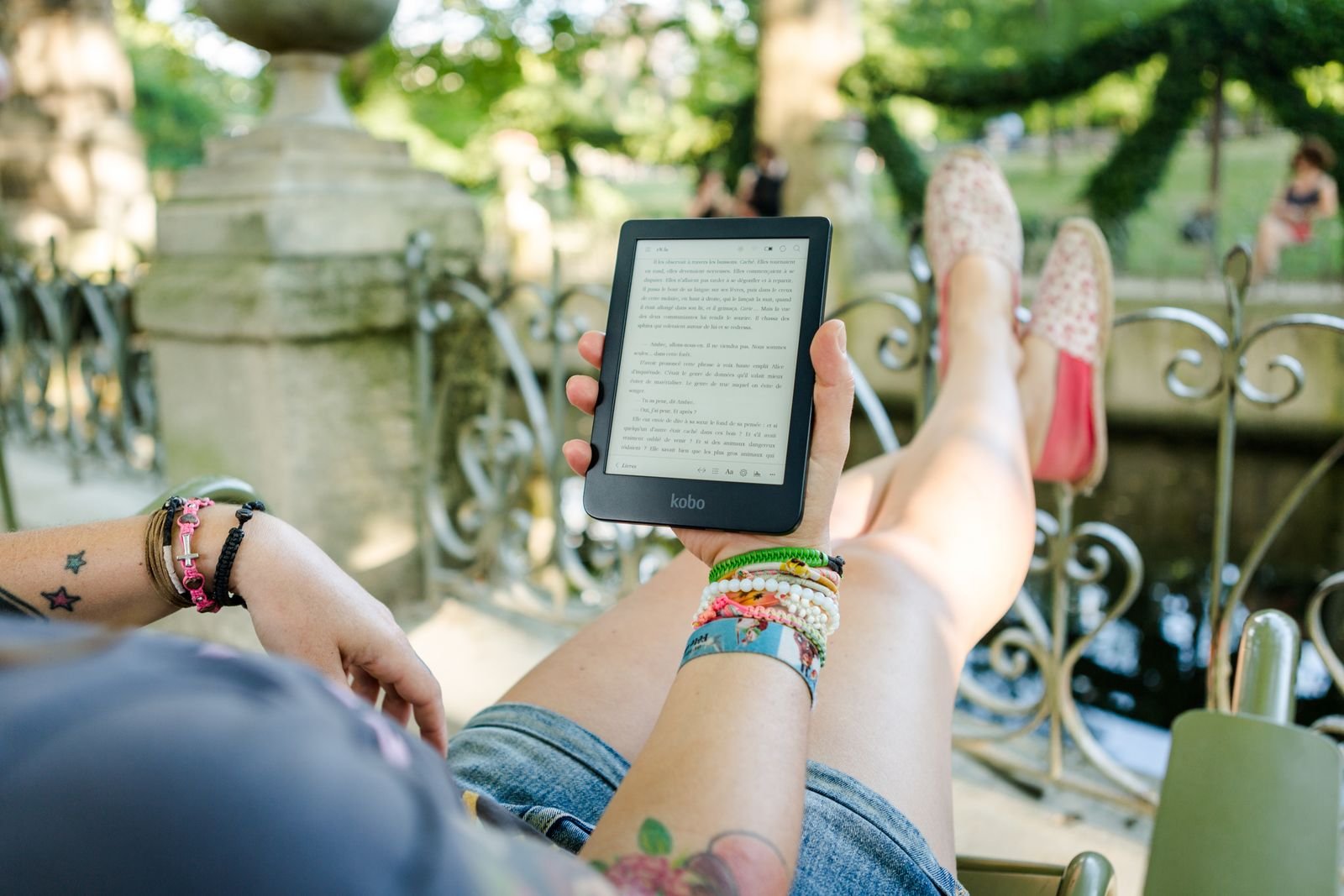 Reading library ebooks on a Kobo e-reader outdoors