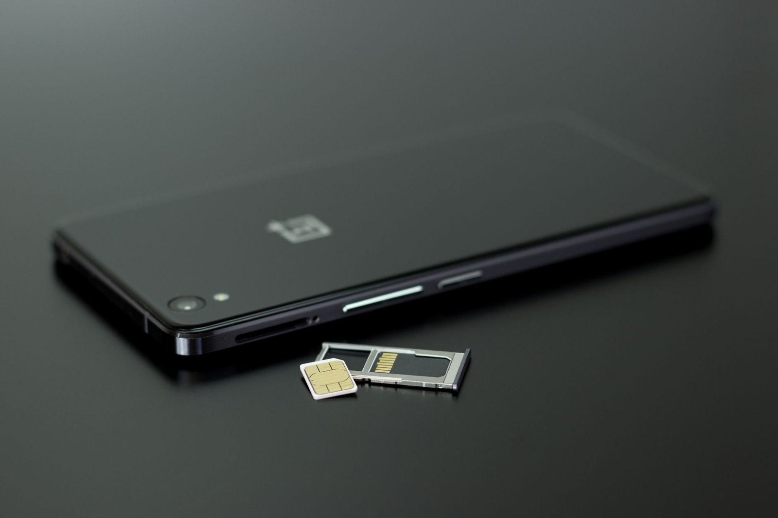 A row of SIM cards from different cheap carriers.