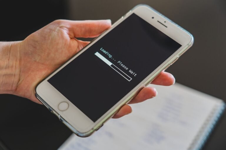 wifi bars vs internet speed shown by a phone stuck on a slow loading screen