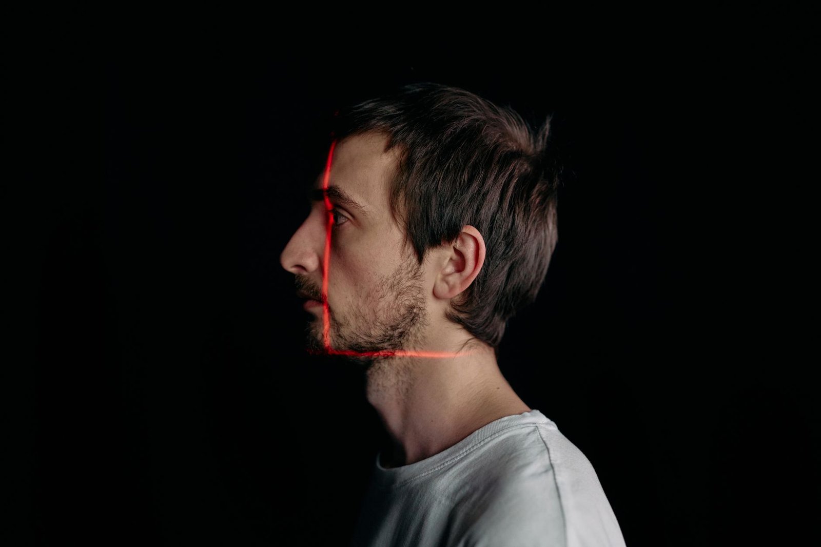 Checklist to spot an AI generated video: a face being scanned for synthetic tells like waxy skin and off-beat blinking