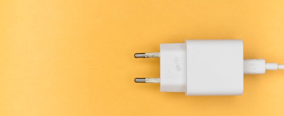 Best GaN charger 2026 pick: a compact white USB-C wall charger on a bright yellow background.
