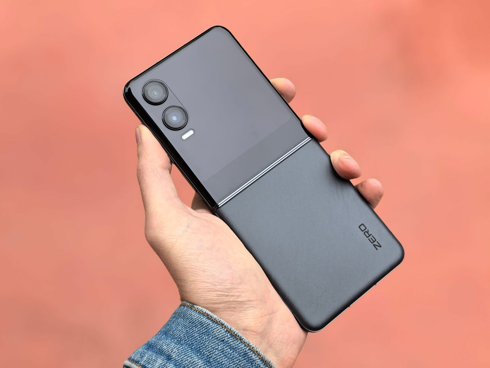 A modern foldable phone folded closed and held in one hand
