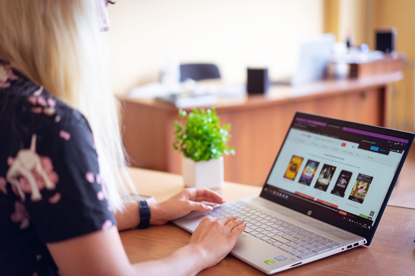 Shopper browsing an online store on a laptop to compare product listings and photos