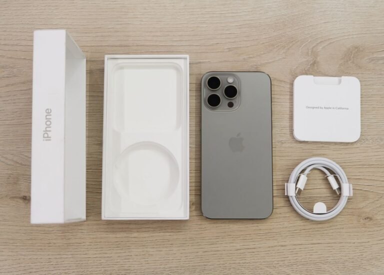 Apple iPhone box, cable and a Pro model laid out for the fall 2026 iPhone launch