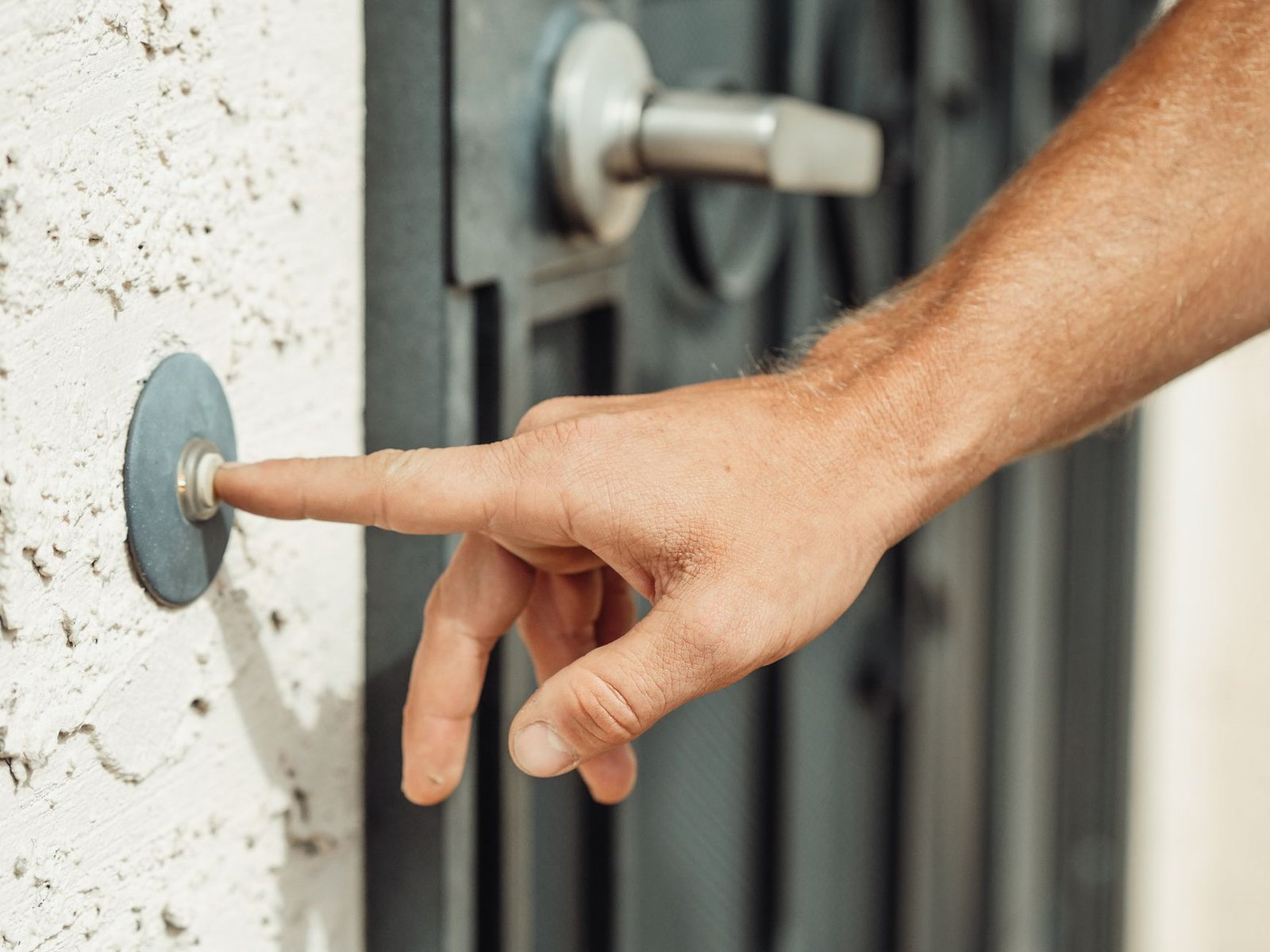 A video doorbell beside a front door